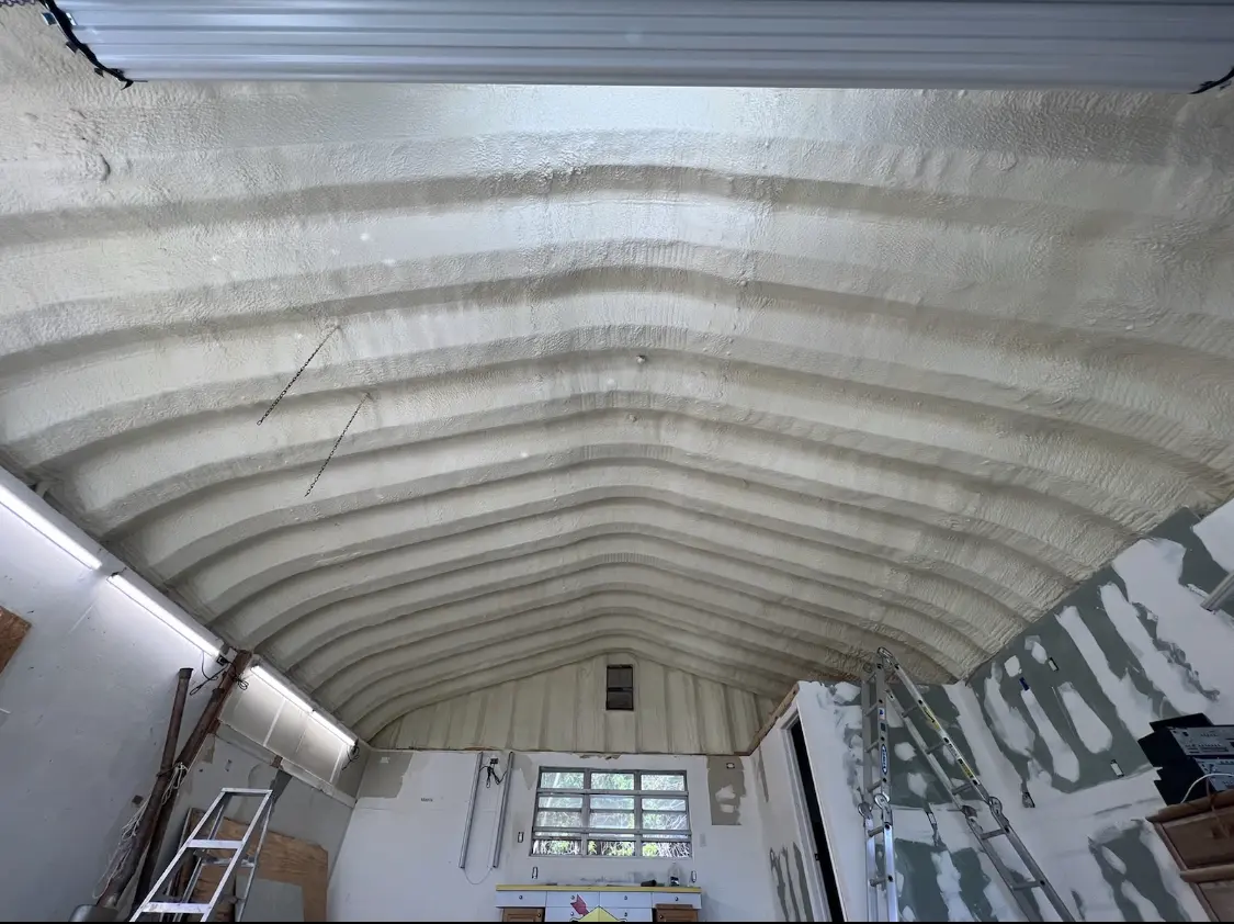 Spray polyurethane foam applied to the underside of a metal roof deck in Lino Lakes